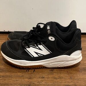 New Balance Black and White baseball turf shoes